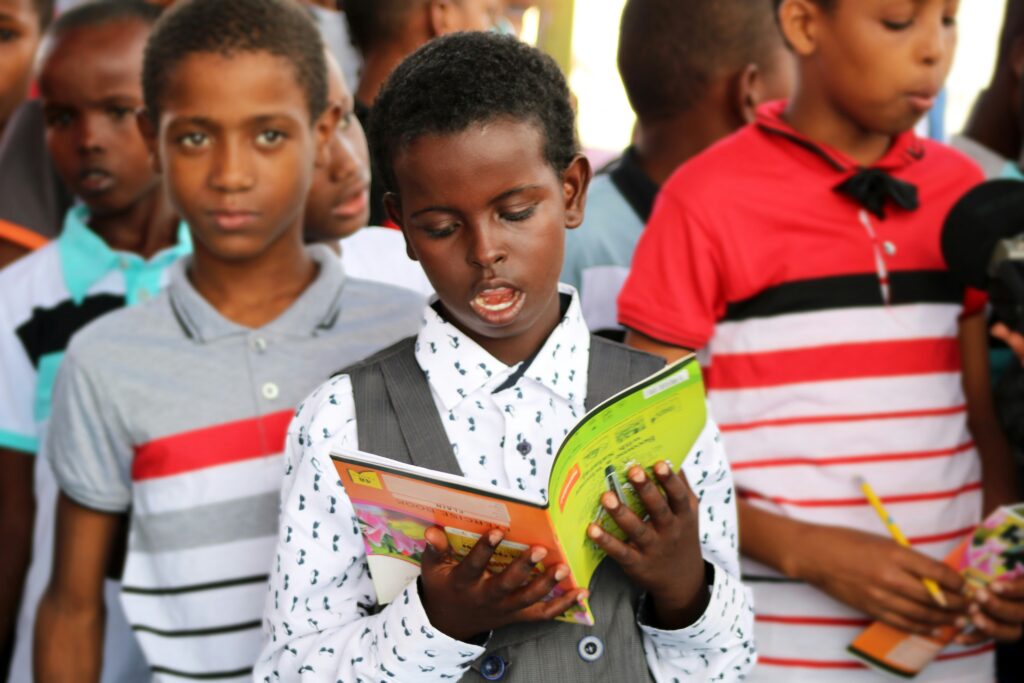 somali roots esol certified exam boy reading